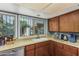 Close up view of the kitchen featuring stainless steel appliances and wooden cabinets at 2041 W Pierson St, Phoenix, AZ 85015