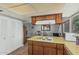 Charming kitchen with wood cabinets, bright countertops, and ample storage space at 2041 W Pierson St, Phoenix, AZ 85015