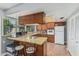 Functional kitchen with light countertops, wood cabinets, and a full suite of appliances at 2041 W Pierson St, Phoenix, AZ 85015