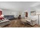 Large living room with tile floor, offering ample seating and natural light at 2041 W Pierson St, Phoenix, AZ 85015