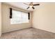 A carpeted bedroom with large window with blinds and dark curtains at 2134 E Broadway Rd # 1062, Tempe, AZ 85282