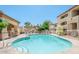 Sparkling community pool surrounded by lush landscaping and comfortable seating at 2134 E Broadway Rd # 1062, Tempe, AZ 85282
