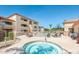 Inviting hot tub surrounded by lounge chairs and palm trees, great for relaxation at 2134 E Broadway Rd # 1062, Tempe, AZ 85282