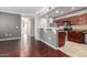 Modern kitchen with stainless steel appliances, granite countertops, and a breakfast bar open to the living area at 2134 E Broadway Rd # 1062, Tempe, AZ 85282