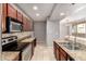 Updated kitchen with stainless steel appliances, granite countertops, tile backsplash, and ample natural light at 2134 E Broadway Rd # 1062, Tempe, AZ 85282