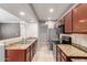 Well-equipped kitchen featuring stainless steel appliances, granite countertops, and ample cabinet space at 2134 E Broadway Rd # 1062, Tempe, AZ 85282