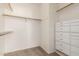 Spacious walk-in closet featuring extensive built-in shelving and organization system at 2134 E Broadway Rd # 1062, Tempe, AZ 85282