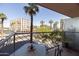 Balcony with a table and chairs offers city views and palm trees at 2201 N Central Ave # 3C, Phoenix, AZ 85004