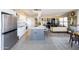 Open-concept kitchen with an island, stainless steel appliances, and adjacent living area at 2201 N Central Ave # 3C, Phoenix, AZ 85004