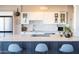 Bright kitchen featuring a large island with seating, white cabinets, and stainless steel appliances at 2201 N Central Ave # 3C, Phoenix, AZ 85004
