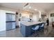 Spacious kitchen showcasing a large island, stainless steel refrigerator, and modern design at 2201 N Central Ave # 3C, Phoenix, AZ 85004