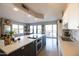Bright kitchen with a center island cooktop, stainless steel appliances, and eat-in bar seating at 2201 N Central Ave # 3C, Phoenix, AZ 85004