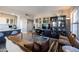 Inviting living room with a sofa, built-in shelving, and open to the kitchen area at 2201 N Central Ave # 3C, Phoenix, AZ 85004