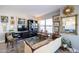 Comfortable living room showcasing eclectic decor, a stylish sofa, and bright natural light at 2201 N Central Ave # 3C, Phoenix, AZ 85004