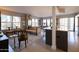 Bright and airy living room featuring a sofa, dining area, and large windows with city views at 2201 N Central Ave # 3C, Phoenix, AZ 85004