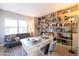 Bright home office with built-in bookshelves, a modern desk, and comfortable seating at 2201 N Central Ave # 3C, Phoenix, AZ 85004