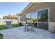 Back patio with barbecue, seating, and view of the backyard and dining area at 22709 S 202Nd St, Queen Creek, AZ 85142