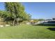 The backyard features a manicured artificial lawn, providing a perfect setting for outdoor relaxation and entertainment at 22709 S 202Nd St, Queen Creek, AZ 85142