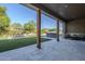 Covered back patio with outdoor kitchen, with view of the pool, spa and dining area at 22709 S 202Nd St, Queen Creek, AZ 85142