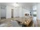A dining room showcases a chandelier and a wooden table with seating for memorable meals at 22709 S 202Nd St, Queen Creek, AZ 85142