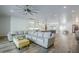 Bright living area with an open floor plan showcasing the kitchen, dining, and living spaces at 22709 S 202Nd St, Queen Creek, AZ 85142