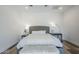 Beautiful main bedroom with decorative lamps and a bench at 22709 S 202Nd St, Queen Creek, AZ 85142