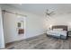 Well-lit main bedroom featuring an ensuite bathroom and sliding barn door at 22709 S 202Nd St, Queen Creek, AZ 85142