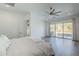 Spacious main bedroom with patio access and an airy atmosphere at 22709 S 202Nd St, Queen Creek, AZ 85142