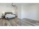Relaxing main bedroom with a stylish headboard and bench at 22709 S 202Nd St, Queen Creek, AZ 85142