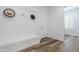 Inviting mudroom features a custom bench and coat rack at 22709 S 202Nd St, Queen Creek, AZ 85142