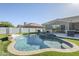 Inviting pool and spa with a waterfall feature, barbecue, patio and dining area at 22709 S 202Nd St, Queen Creek, AZ 85142
