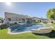 Inviting backyard pool with spa, featuring artificial turf, barbecue, patio and dining area at 22709 S 202Nd St, Queen Creek, AZ 85142