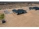 An aerial image of a new home and surrounding desert acreage with blue skies at 2689 S 305Th Ave Ave, Buckeye, AZ 85326