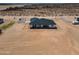 An aerial view of a new home and surrounding acreage with desert landscape at 2689 S 305Th Ave Ave, Buckeye, AZ 85326