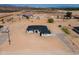 An aerial view of a new home surrounded by native desert landscape at 2689 S 305Th Ave Ave, Buckeye, AZ 85326
