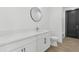 A bathroom boasts a vanity with solid counters and modern fixtures at 2689 S 305Th Ave Ave, Buckeye, AZ 85326