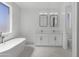 Bright bathroom featuring marble floors, double vanity, soaking tub, and neutral paint at 2689 S 305Th Ave Ave, Buckeye, AZ 85326