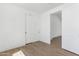 Bright bedroom boasts wood-look floors and a closet with sliding doors at 2689 S 305Th Ave Ave, Buckeye, AZ 85326