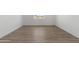 Bedroom with new wood-look floors, bright white walls and trim, plus a view to the front yard at 2689 S 305Th Ave Ave, Buckeye, AZ 85326