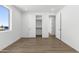 Bright, airy bedroom with wood-look floors and direct access to both a closet and bathroom at 2689 S 305Th Ave Ave, Buckeye, AZ 85326