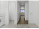 Bright hallway featuring wood floors leading to the bathroom and bedroom at 2689 S 305Th Ave Ave, Buckeye, AZ 85326