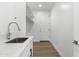 A laundry room features a faucet and a door leading to the outside at 2689 S 305Th Ave Ave, Buckeye, AZ 85326