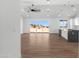 Bright living room featuring wood floors, ceiling fan, and large windows with a view at 2689 S 305Th Ave Ave, Buckeye, AZ 85326