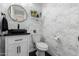 Stylish powder room featuring designer wallpaper and a vessel sink at 2879 E Austin Dr, Gilbert, AZ 85296