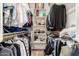 Organized walk-in closet with ample storage space, featuring shelving and hanging rods for clothing and accessories at 2879 E Austin Dr, Gilbert, AZ 85296