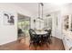 Cozy dining area with backyard access, modern lighting, and hardwood flooring at 2879 E Austin Dr, Gilbert, AZ 85296