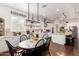 Open dining area with hardwood floors, pendant lighting, and a view of the kitchen at 2879 E Austin Dr, Gilbert, AZ 85296
