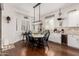 Bright dining nook with a modern chandelier, storage, and backyard views at 2879 E Austin Dr, Gilbert, AZ 85296