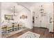 Bright dining room featuring a wood table, stylish chandelier, and hardwood floors at 2879 E Austin Dr, Gilbert, AZ 85296