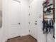 Well-lit entryway with interior doors and mud room area with storage rack and hooks for coats, leashes, and accessories at 2879 E Austin Dr, Gilbert, AZ 85296